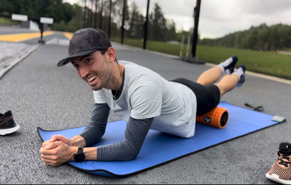 Eric foam rolling after a workout.