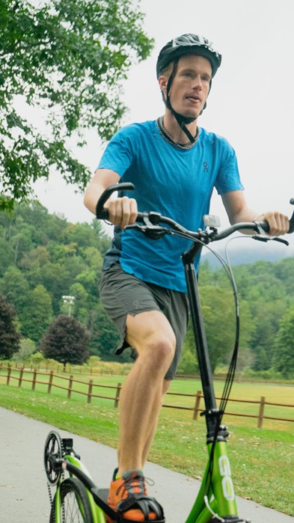 Johnny using the ElliptiGo to demonstrate how to recover from a marathon.